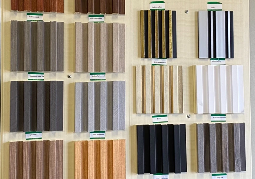 Fluted decorative wall-panel samples in wood tones, dark finishes, white, and metallic accents.